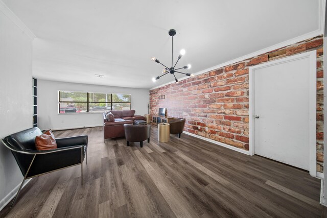 356 SE Prima Vista Blvd, Port Saint Lucie, FL 34983 - living area featuring a chandelier, brick wall, wood finished floors, crown molding, and baseboards