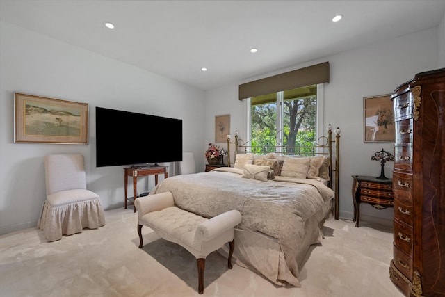 bedroom featuring light colored carpet, recessed lighting, and baseboards