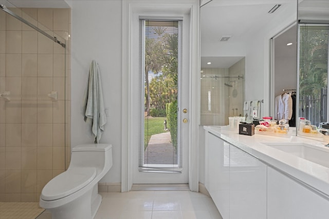 full bath featuring tile patterned floors, a stall shower, toilet, and plenty of natural light