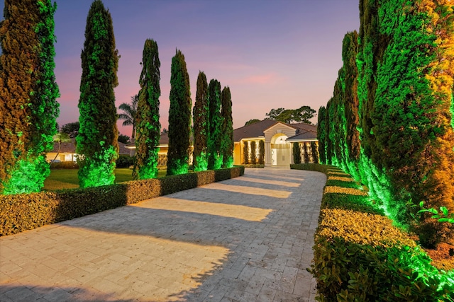 view of front of house with decorative driveway