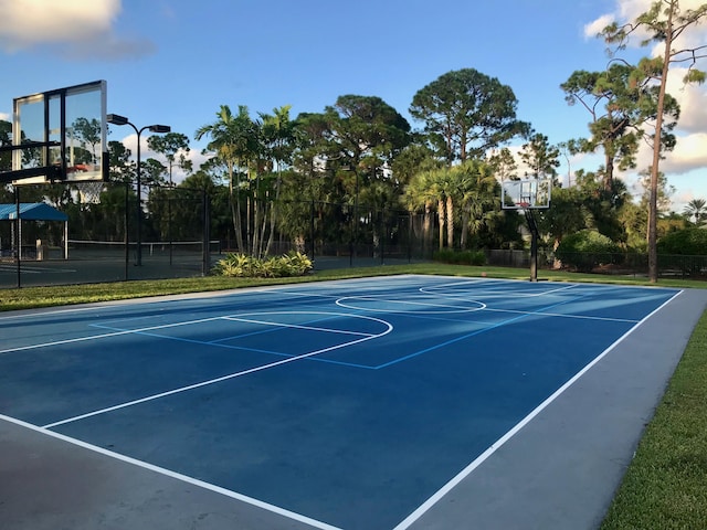 view of sport court featuring community basketball court and fence