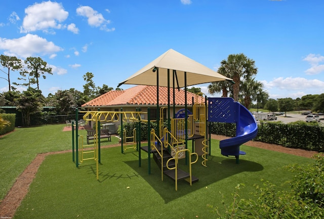 view of play area featuring a lawn and central air condition unit