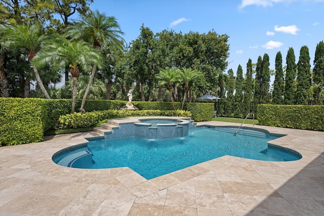 view of pool with a pool with connected hot tub and a patio