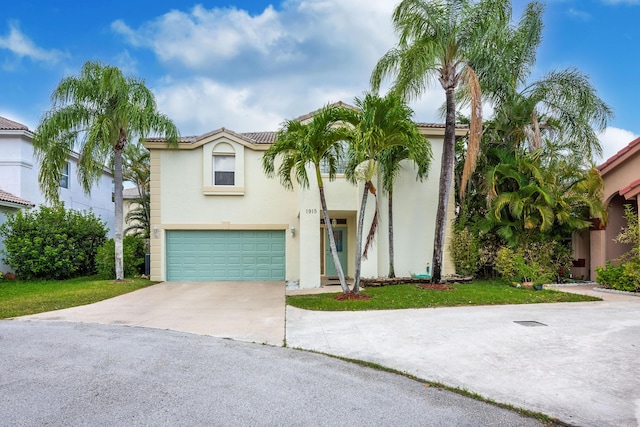 1915 Capeside Cir, Wellington, FL 33414 - view of front of house with stucco siding, concrete driveway, and a garage