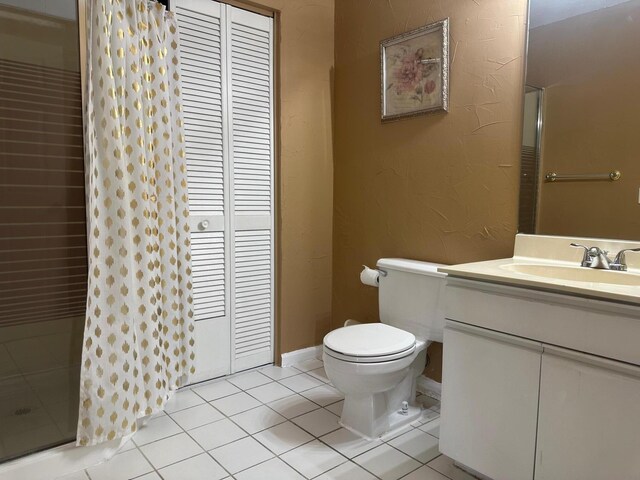 1915 Capeside Cir, Wellington, FL 33414 - full bathroom featuring toilet, vanity, tile patterned flooring, a shower with curtain, and a closet