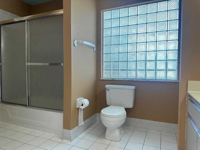 1915 Capeside Cir, Wellington, FL 33414 - full bath featuring tile patterned flooring, toilet, vanity, shower / bath combination with glass door, and baseboards