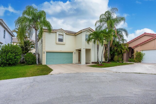 1915 Capeside Cir, Wellington, FL 33414 - view of front of home featuring concrete driveway, stucco siding, an attached garage, a front lawn, and a tile roof