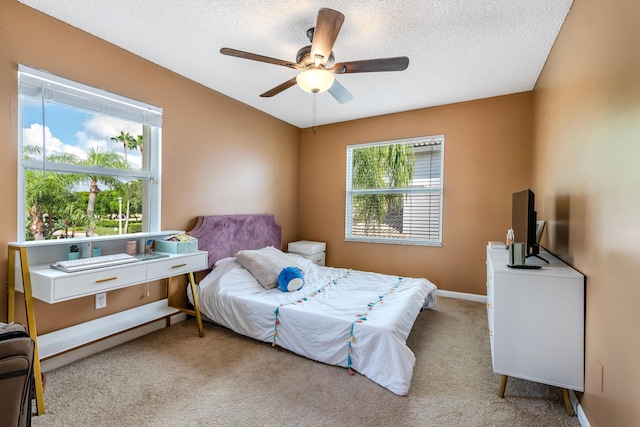 1915 Capeside Cir, Wellington, FL 33414 - bedroom with carpet floors, a textured ceiling, a ceiling fan, and baseboards