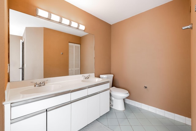 1915 Capeside Cir, Wellington, FL 33414 - full bathroom with toilet, double vanity, tile patterned floors, and baseboards