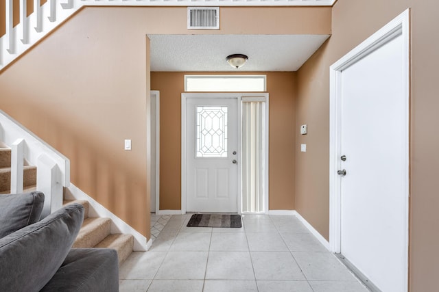 1915 Capeside Cir, Wellington, FL 33414 - foyer entrance featuring stairway, light tile patterned floors, and baseboards