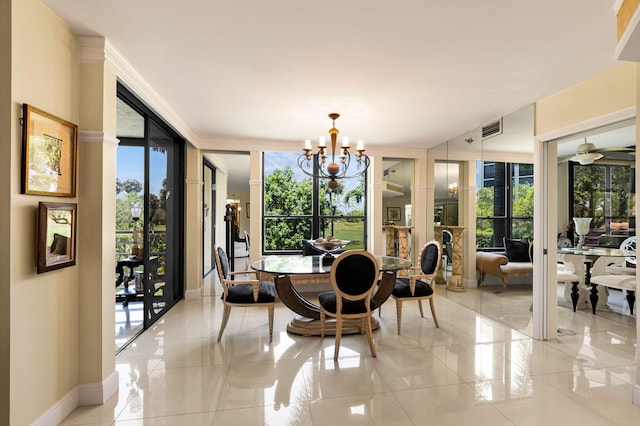 dining room featuring a chandelier and baseboards