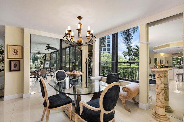 dining area with healthy amount of natural light, a chandelier, baseboards, and ceiling fan