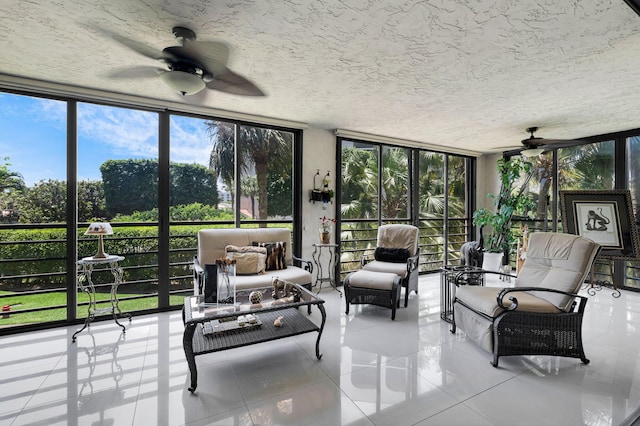 sunroom featuring ceiling fan and healthy amount of natural light