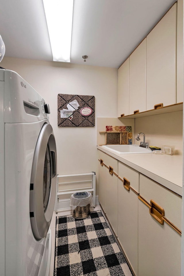 laundry room with cabinet space and washer / clothes dryer