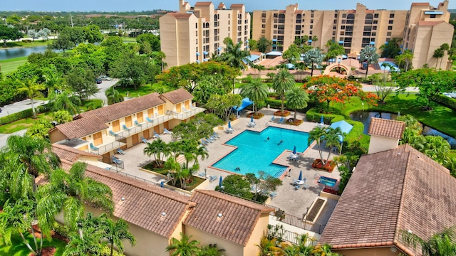 bird's eye view of a pool area and a nearby body of water
