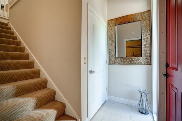 10267 N Andover Coach Ln Unit B2, Lake Worth, FL 33449 - staircase with tile patterned flooring and baseboards