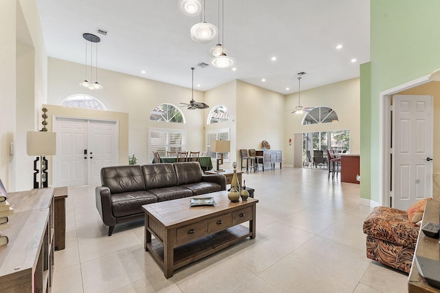 7793 Highlands Cir, Margate, FL 33063 - living room featuring a high ceiling, a ceiling fan, light tile patterned floors, and recessed lighting