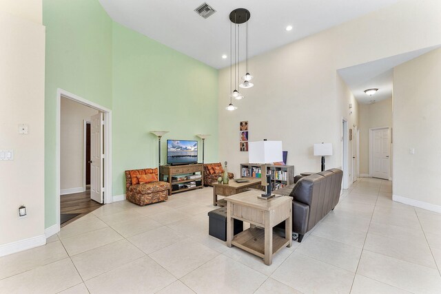 7793 Highlands Cir, Margate, FL 33063 - living area with a high ceiling, light tile patterned floors, baseboards, and recessed lighting