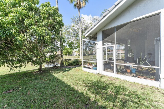 7793 Highlands Cir, Margate, FL 33063 - view of green lawn with a sunroom