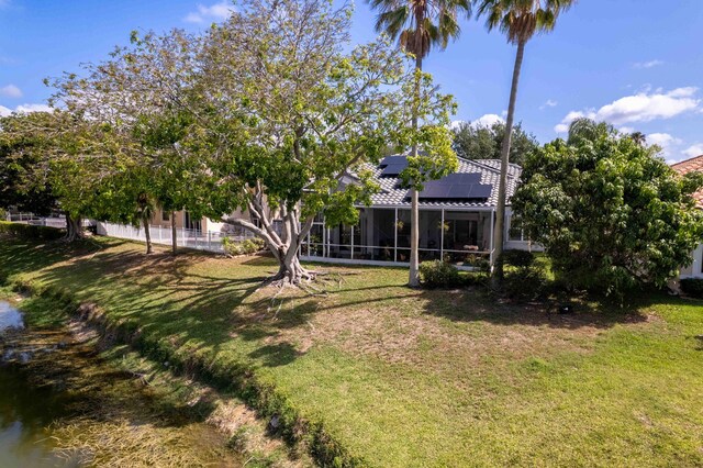 7793 Highlands Cir, Margate, FL 33063 - view of grassy yard featuring a sunroom
