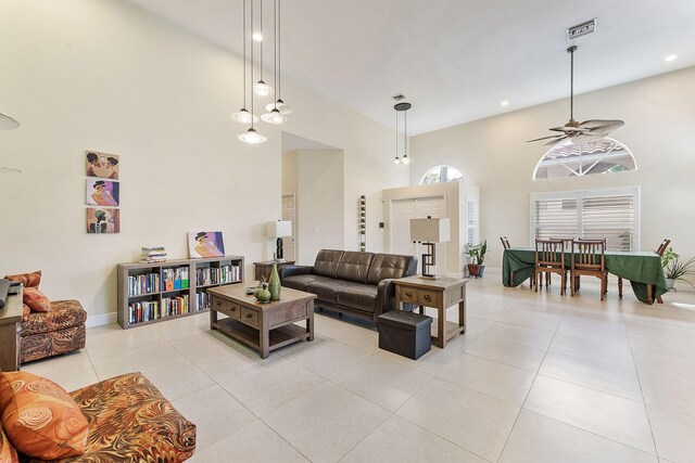 7793 Highlands Cir, Margate, FL 33063 - living room with a towering ceiling, ceiling fan, light tile patterned flooring, baseboards, and recessed lighting
