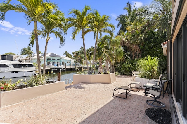 view of patio with a water view