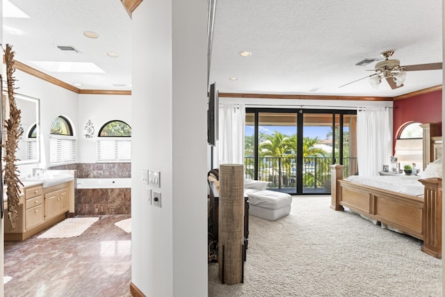 bedroom featuring ornamental molding, access to exterior, multiple windows, a textured ceiling, and recessed lighting
