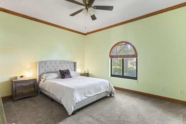 bedroom with carpet, baseboards, crown molding, and a ceiling fan