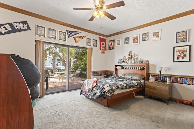 bedroom with carpet flooring, access to exterior, a textured ceiling, crown molding, and a ceiling fan