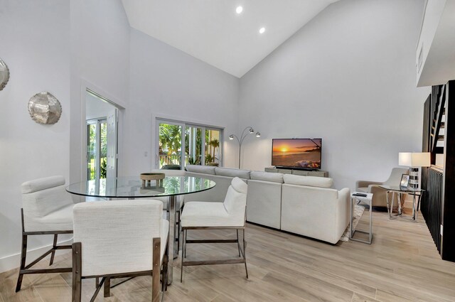 3704 Fairway Dr N, Jupiter, FL 33477 - dining space with high vaulted ceiling, light wood-style floors, and recessed lighting