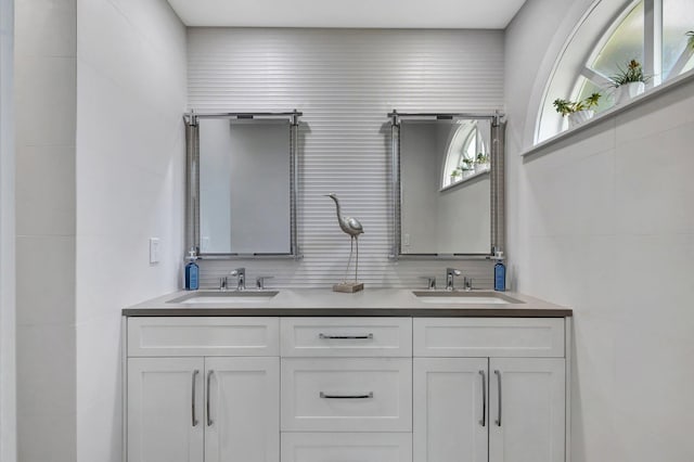 3704 Fairway Dr N, Jupiter, FL 33477 - bathroom featuring double vanity and tile walls