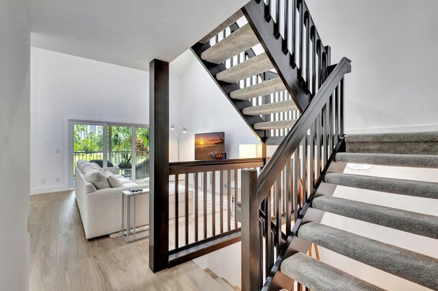 3704 Fairway Dr N, Jupiter, FL 33477 - stairway with wood finished floors and baseboards
