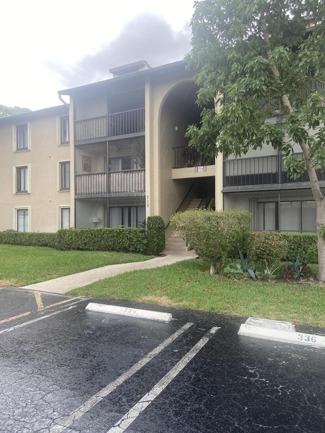 719 Sunny Pine Way Unit G1, Greenacres, FL 33415 - view of property with uncovered parking