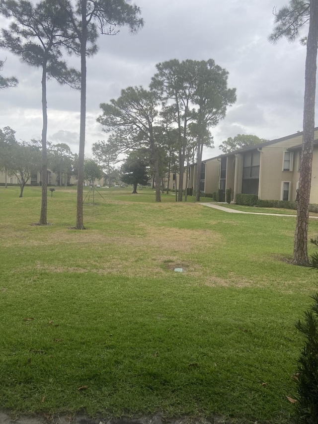 719 Sunny Pine Way Unit G1, Greenacres, FL 33415 - view of green lawn