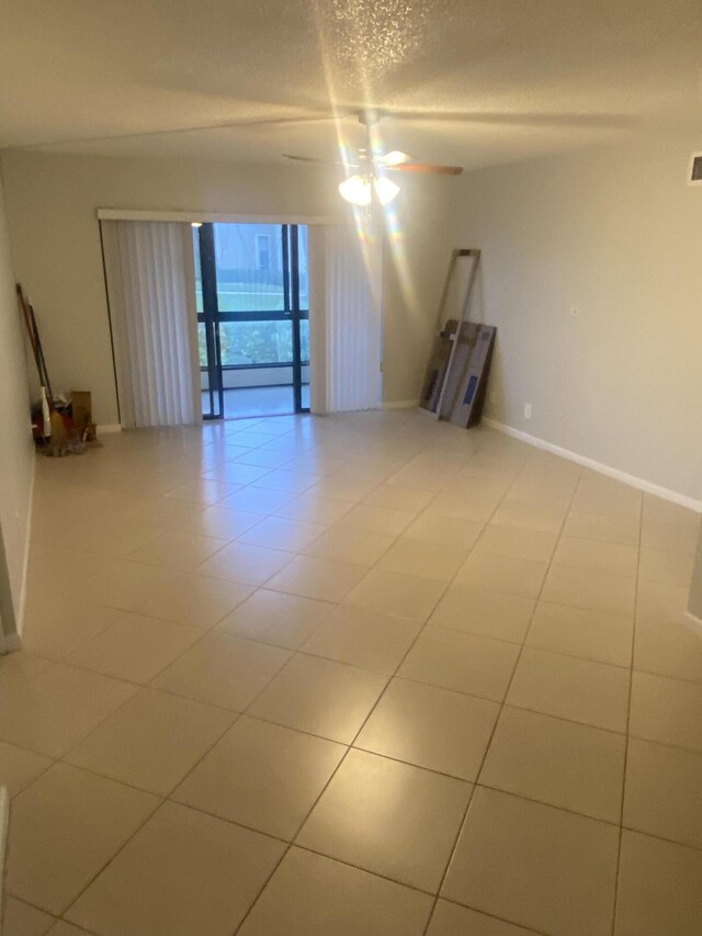 719 Sunny Pine Way Unit G1, Greenacres, FL 33415 - spare room with ceiling fan and baseboards