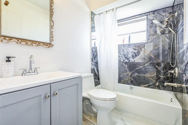 bathroom featuring toilet, shower / bath combo with shower curtain, and vanity