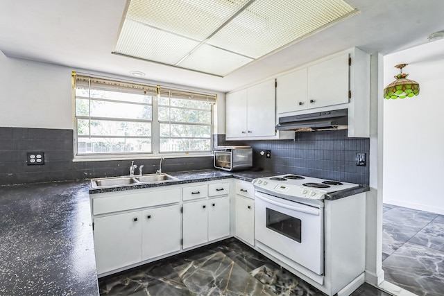 kitchen with under cabinet range hood, electric stove, a sink, dark countertops, and dark marble finish flooring