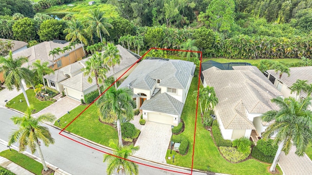aerial view of property and surrounding area featuring property parcel outlined