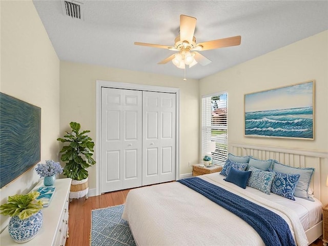800 Alexandra Ave SW, Vero Beach, FL 32968 - bedroom featuring wood finished floors, a closet, baseboards, and ceiling fan