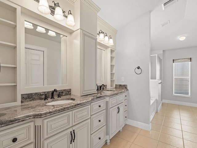 800 Alexandra Ave SW, Vero Beach, FL 32968 - bathroom with tile patterned floors, a shower, double vanity, baseboards, and built in shelves