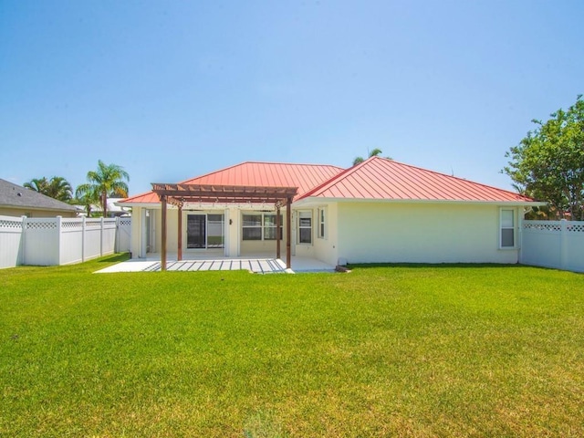 800 Alexandra Ave SW, Vero Beach, FL 32968 - rear view of property with a standing seam roof, a pergola, metal roof, and a patio