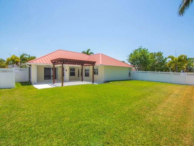 800 Alexandra Ave SW, Vero Beach, FL 32968 - back of house with a pergola, a patio, metal roof, and a standing seam roof