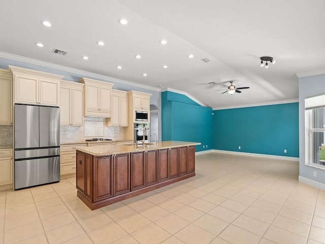 800 Alexandra Ave SW, Vero Beach, FL 32968 - kitchen featuring appliances with stainless steel finishes, cream cabinetry, crown molding, ceiling fan, and backsplash