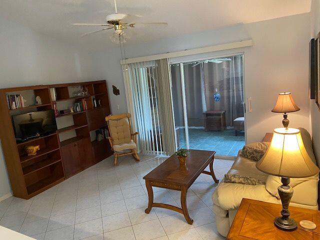 378 NW Sherry Ln, Port Saint Lucie, FL 34986 - living area featuring a ceiling fan and light tile patterned floors