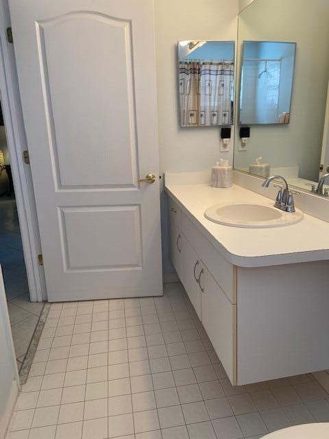 378 NW Sherry Ln, Port Saint Lucie, FL 34986 - bathroom featuring vanity and tile patterned flooring