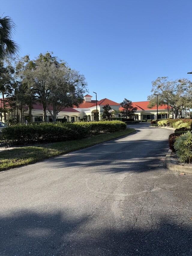378 NW Sherry Ln, Port Saint Lucie, FL 34986 - view of asphalt road with street lighting