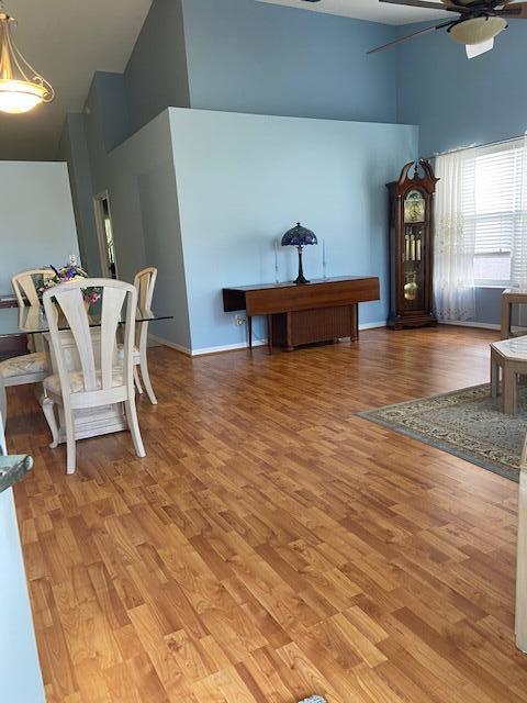 378 NW Sherry Ln, Port Saint Lucie, FL 34986 - dining space featuring high vaulted ceiling, ceiling fan, and light wood finished floors