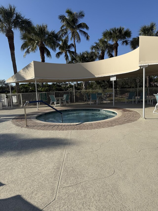 378 NW Sherry Ln, Port Saint Lucie, FL 34986 - view of pool with fence, a swimming pool, and a patio
