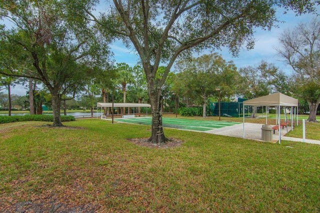 378 NW Sherry Ln, Port Saint Lucie, FL 34986 - view of green lawn with shuffleboard and a water view