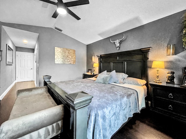 bedroom with lofted ceiling, wood finished floors, a ceiling fan, and baseboards